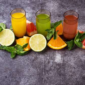Selection of fresh citrus juices. Detox drinks. Selective focus